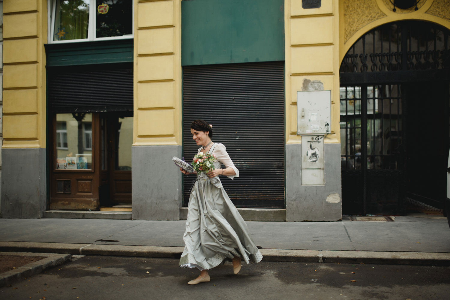 vienna bride running back home to get bouquet