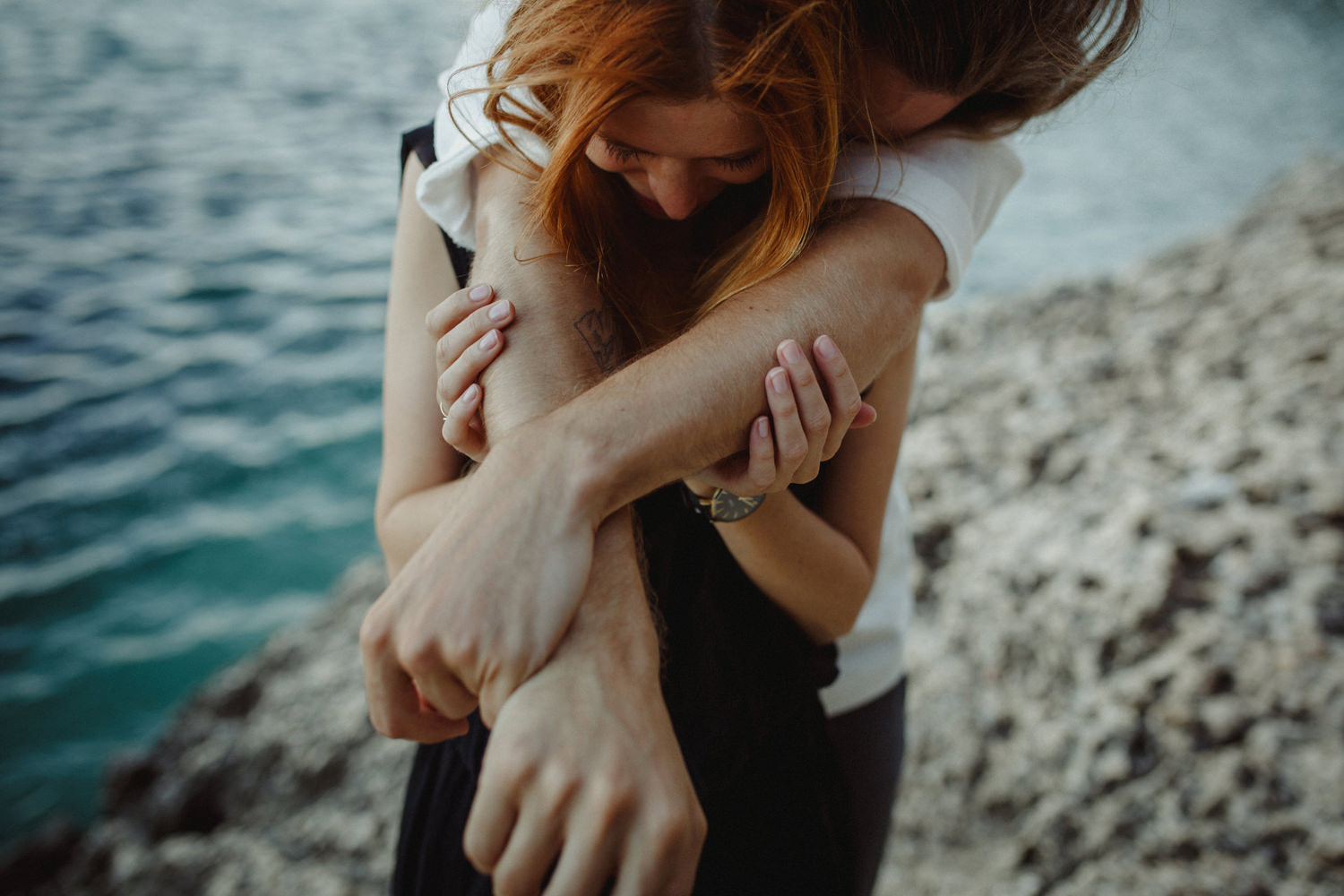 hugging hipster couple in portugal engagement session